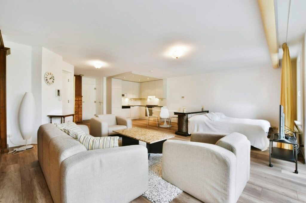 The interior of a delightful room with a bed and a living area